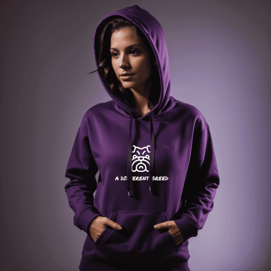 Woman wearing purple hoodie with  a print which reads a different breed across the chest
