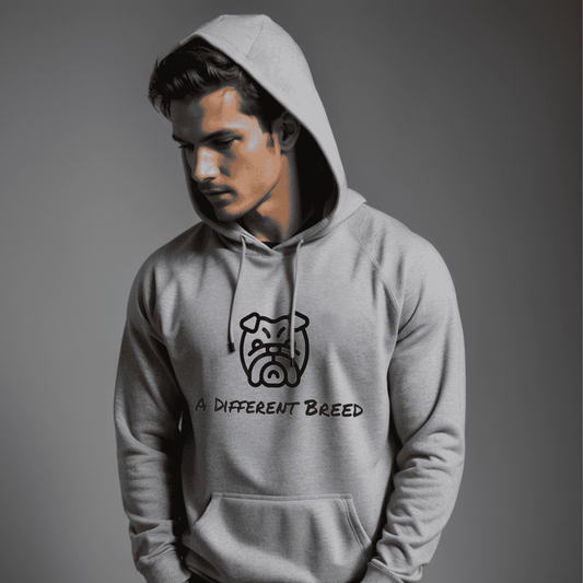Man wearing grey hoodie with  a print which reads a different breed across the chest