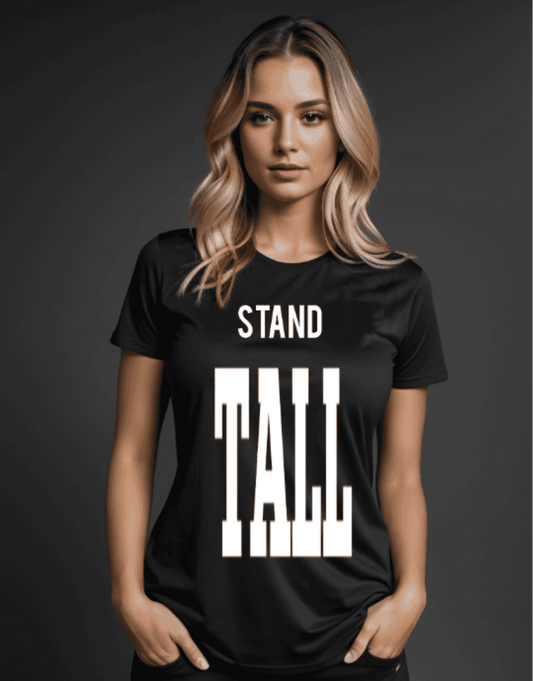 a woman wearing a black t - shirt that says stand tall